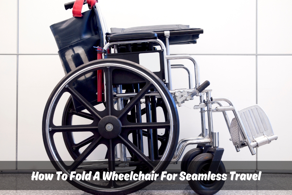 Close-up image of a black folded wheelchair against a white tiled background, demonstrating 'how to fold a wheelchair' for easy storage and transport.